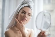Using sunscreen (Image via Pexels/Andrea Piacquadio)